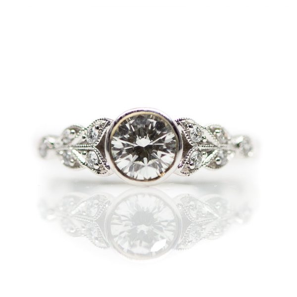, Bezel Set Engagement Ring set in 14kt white gold with 0.56ct diamond center