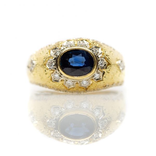 , Vintage Oval Sapphire Fashion Ring Bezel Set in a Yellow Gold and Diamond Mounting