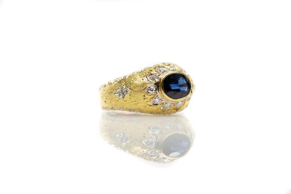 , Vintage Oval Sapphire Fashion Ring Bezel Set in a Yellow Gold and Diamond Mounting