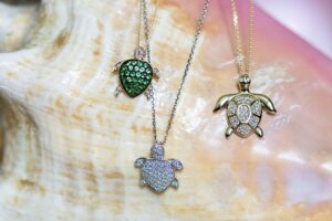 sea turtle necklaces on a conch shell