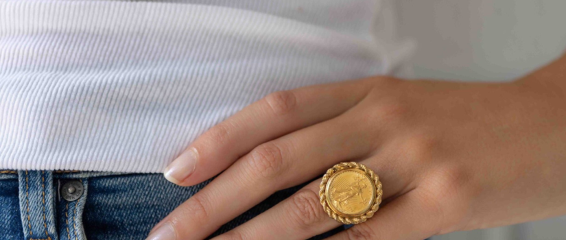 woman modeling vintage coin ring